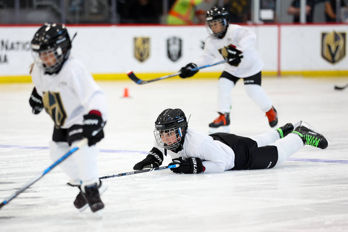 Young hockey players practice diving to the ice during the NHL Draft Prospect Youth Hockey Clin ...