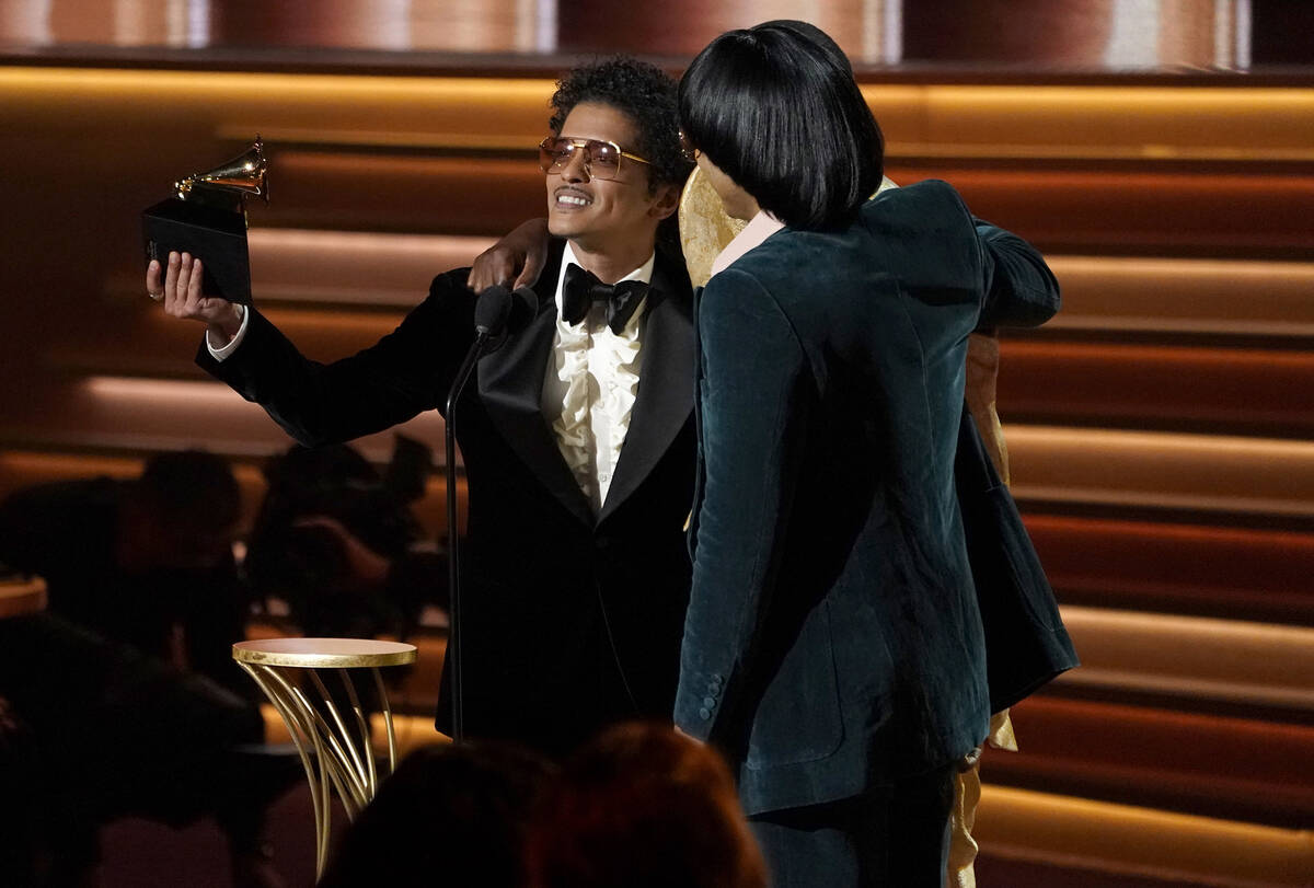 Bruno Mars, left, and Anderson .Paak of Silk Sonic accept the award for song of the year for &q ...