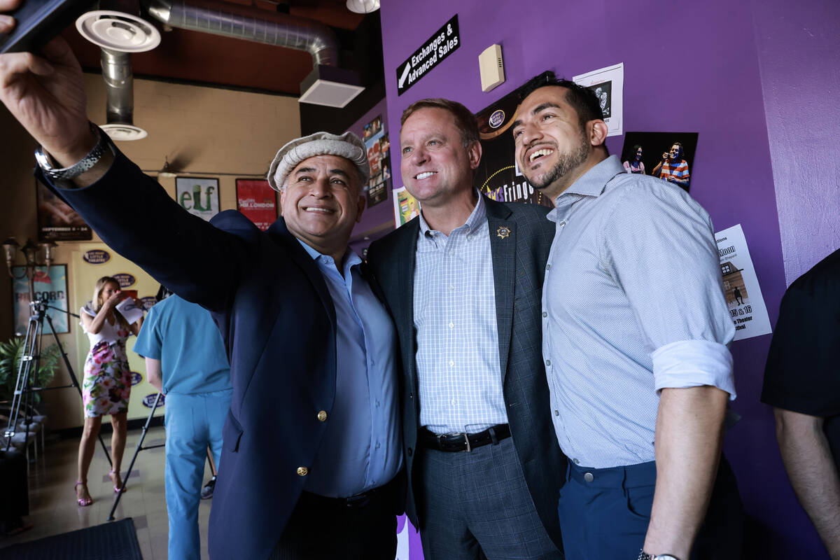 Clark County Sheriff Kevin McMahill, center, poses with Rokai Yusufzai, left, and his son Nawee ...