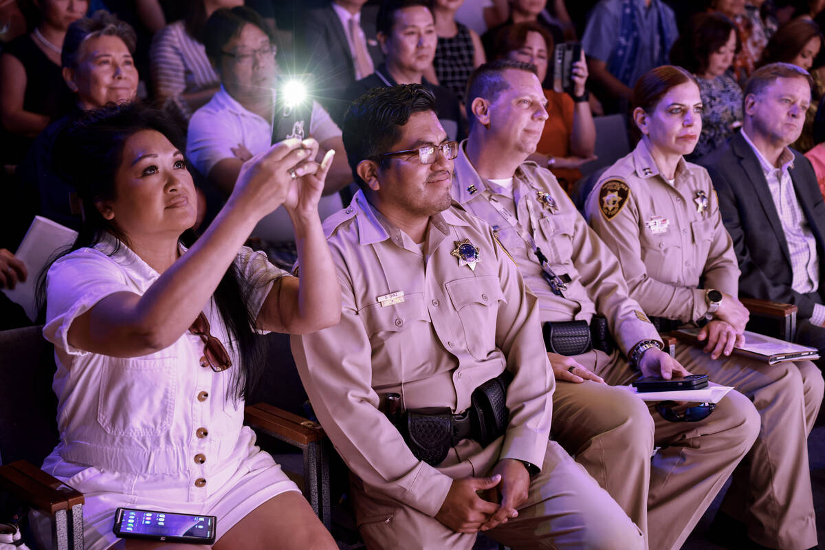 Las Vegas police and members of the Asian American Pacific Islander (AAPI) community watch ente ...