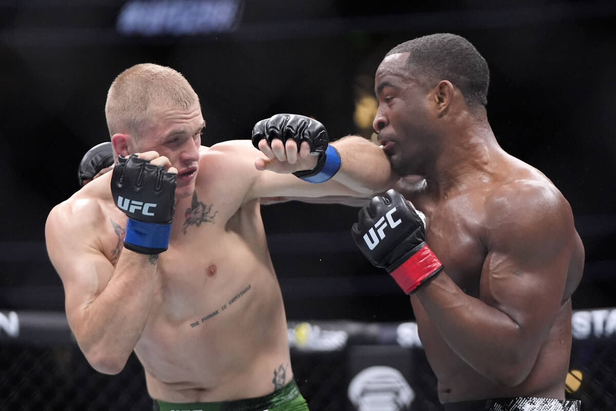 Ian Machado Garry, left, connects with Geoff Neal during their welterweight bout at the UFC 298 ...