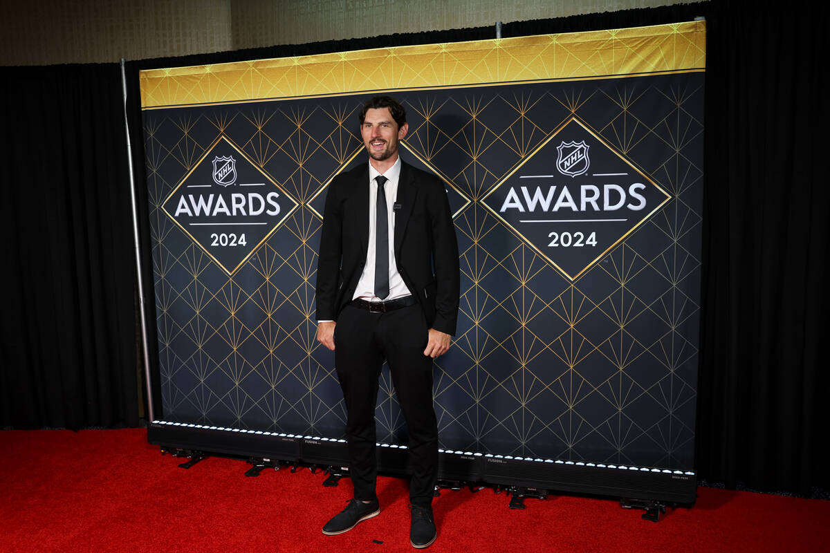 Winnipeg Jets goaltender Connor Hellebuyck poses on the red carpet before the NHL Awards at Fon ...