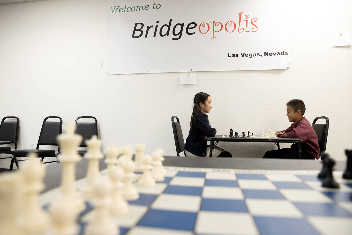 Julia Wang, left, faces Timi Guo in a chess game before their lesson at Bridgeopolis on Tuesday ...