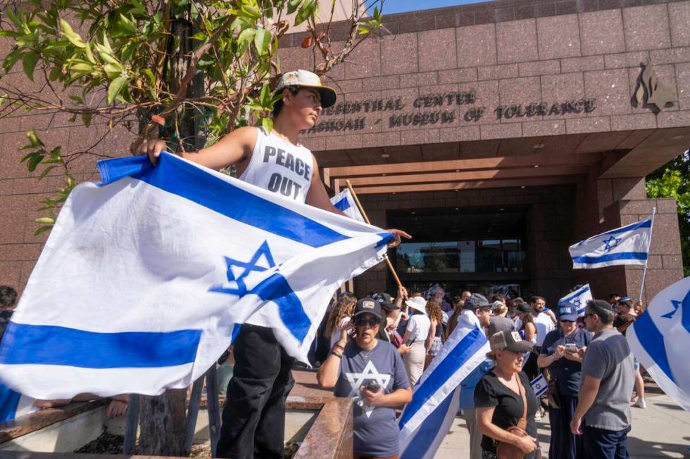 FILE - Eldar Avital, 12, left, joins pro-Israel supporters to condemn a violent protest the pre ...