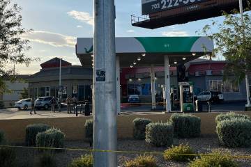 Police investigate a shooting by officers in the 6400 block of Boulder Highway on Wednesday, Ju ...