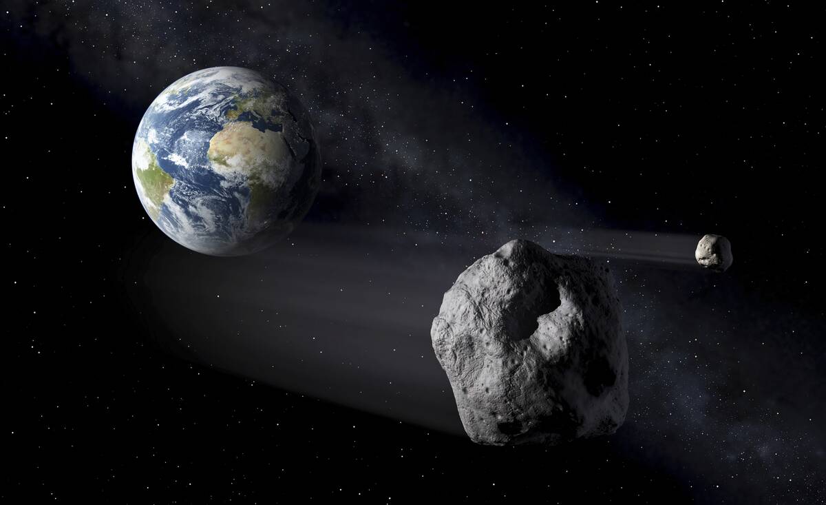 In this artistic rendering, two asteroids fly past Earth. An asteroid will whiz harmlessly past ...