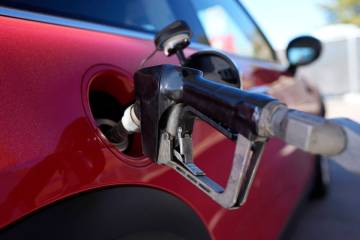 A motorist fills up the fuel tank of a vehicle at a Shell station Friday, Nov. 17, 2023, in Eng ...