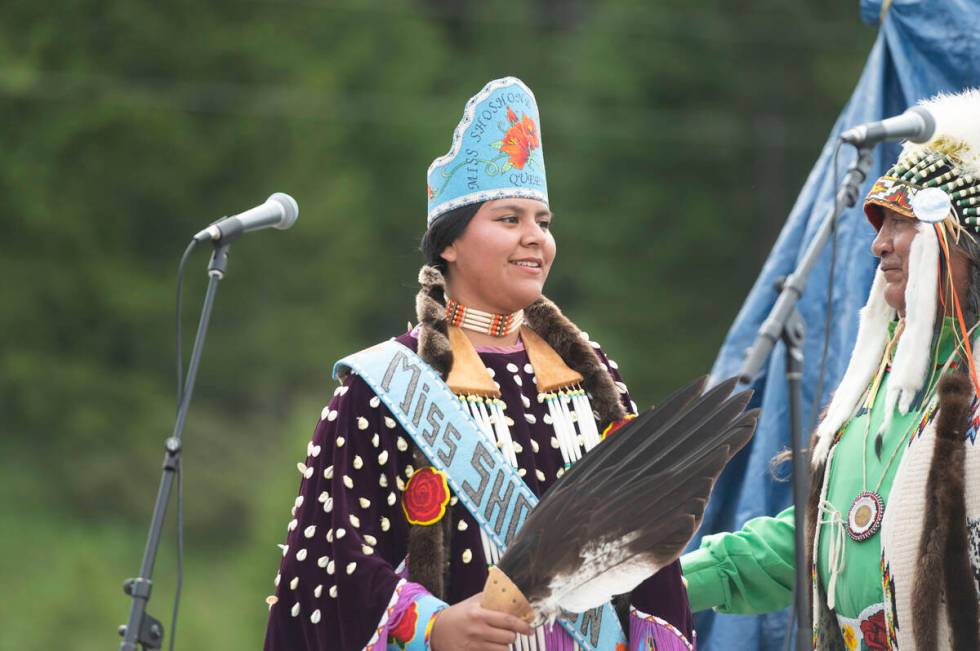 Miss Shoshnone-Bannock Queen Develynn Hall takes the stage during a naming ceremony for a white ...