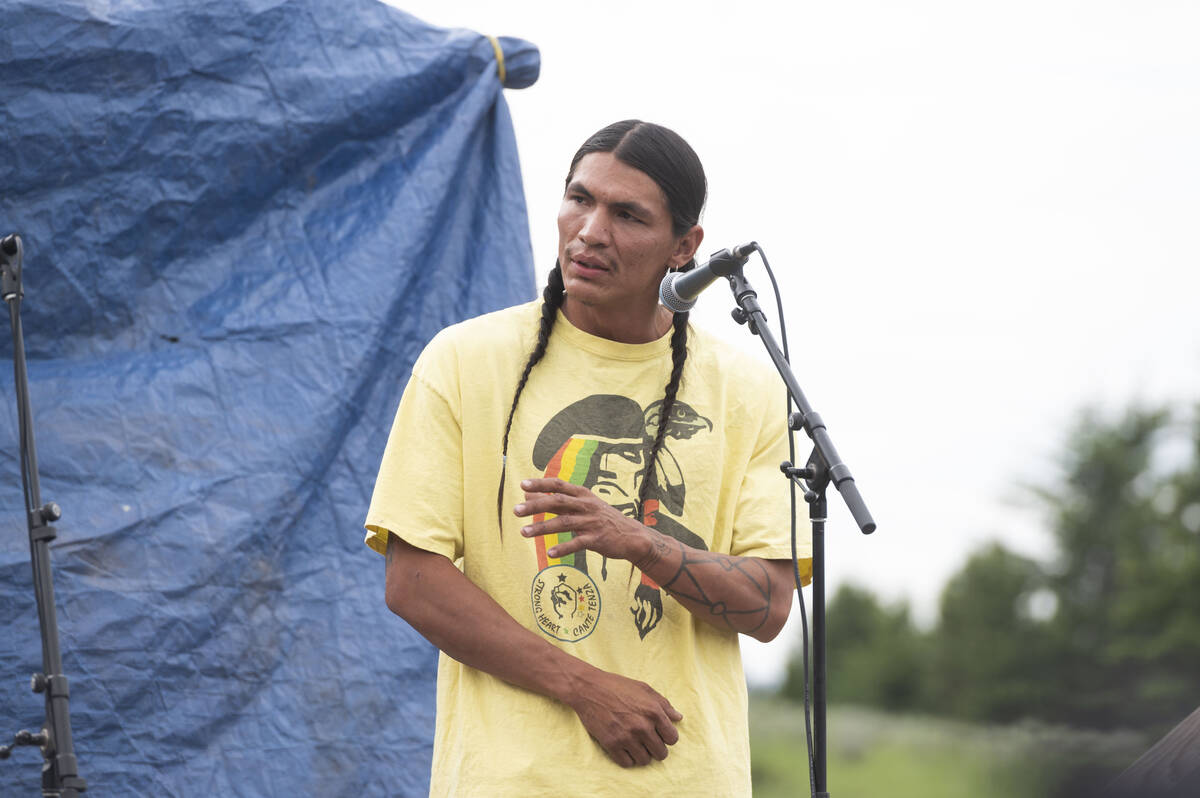 Devin Oldman, a member of the Northern Arapahoe tribe, speaks during a naming ceremony for a wh ...
