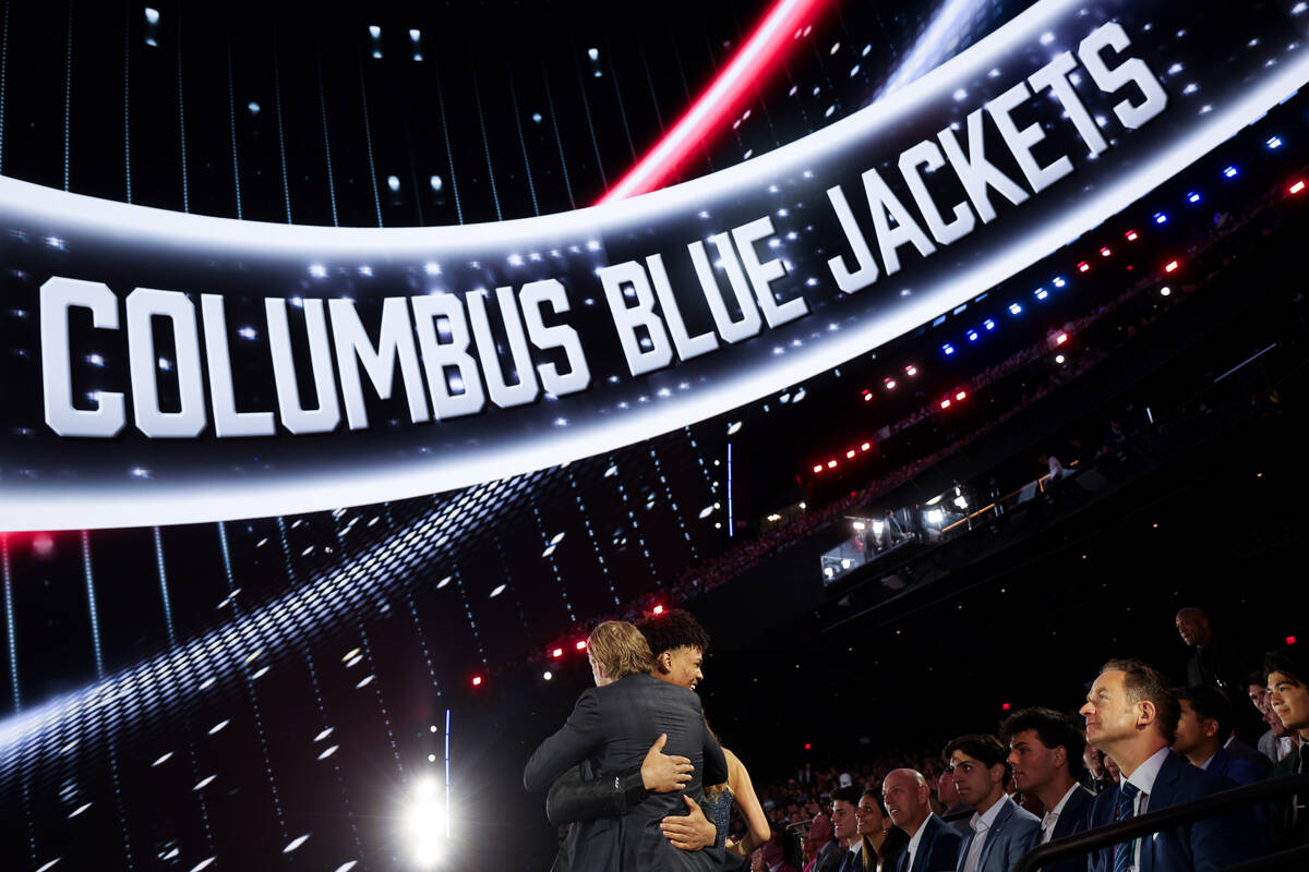 Cayden Lindstrom embraces loved ones after the Columbus Blue Jackets selected him fourth overal ...
