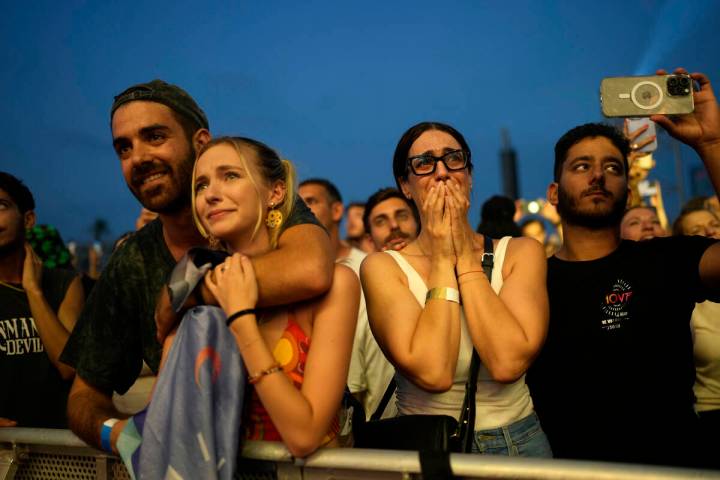 A woman weeps at the Nova Healing Concert in Tel Aviv, Israel, on Thursday, June 27, 2024. This ...