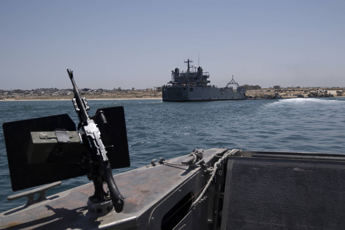 A U.S. Army vessel is seen moored at the U.S.-built floating pier Trident that connects to the ...