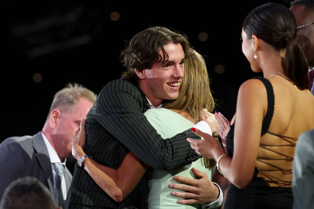 Forward Trevor Connelly embraces his loved ones after the Vegas Golden Knights selected him 19t ...