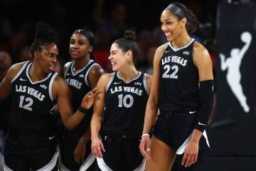 Las Vegas Aces center A'ja Wilson (22) and teammates Chelsea Gray (12), Jackie Young (0) and Ke ...