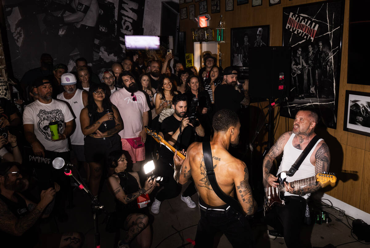 Tim Stewart, left, and Jonny Goood, of Damnage, right, perform at the Punk Rock Museum on Frida ...