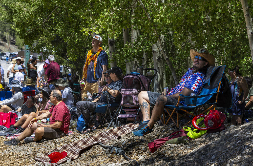 People take to the shade as they listen to live music during the Mountain Fest on Rabbit Peak a ...
