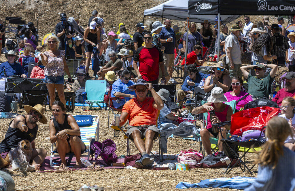 People listen to live music during the Mountain Fest on Rabbit Peak at Mount Charleston on Satu ...