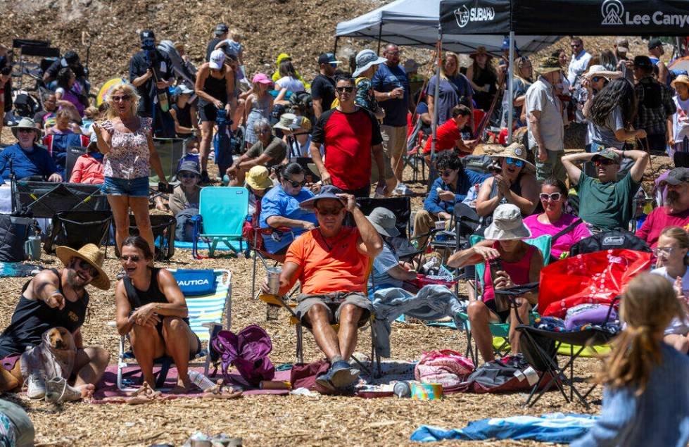 People listen to live music during the Mountain Fest on Rabbit Peak at Mount Charleston on Satu ...