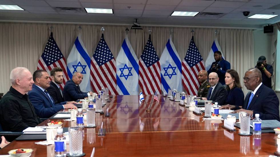 Defense Secretary Lloyd Austin, right, and Israeli Defense Minister Yoav Gallant, second from l ...