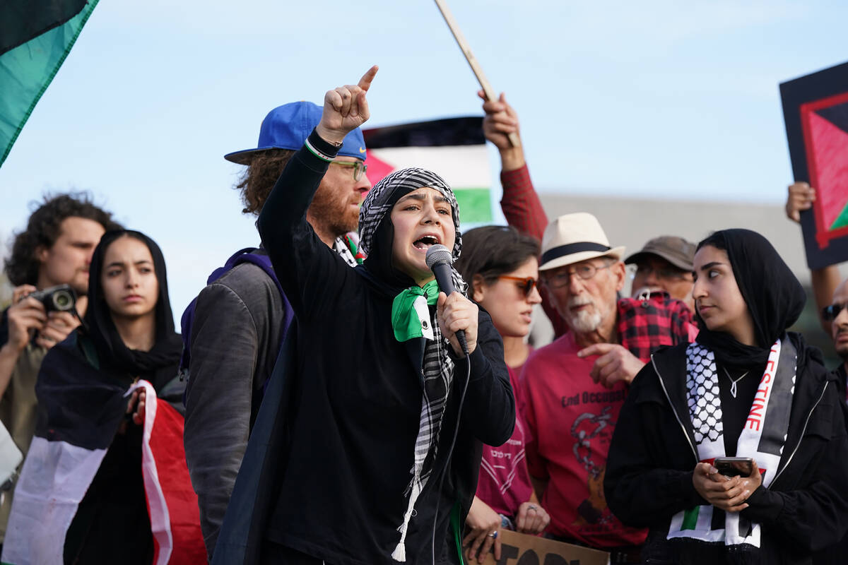 A pro-Palestinian activist speaks during a march near University of Pittsburgh Friday, Oct. 13, ...