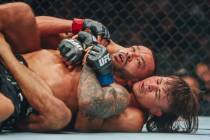 Diego Lopes pins down Dan Ige during their catchweight bout at UFC 303 at T-Mobile Arena on Sat ...