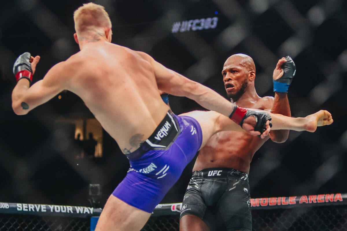 Ian Machado Garry, left, kicks Michael Page during their welterweight bout at UFC 303 at T-Mobi ...