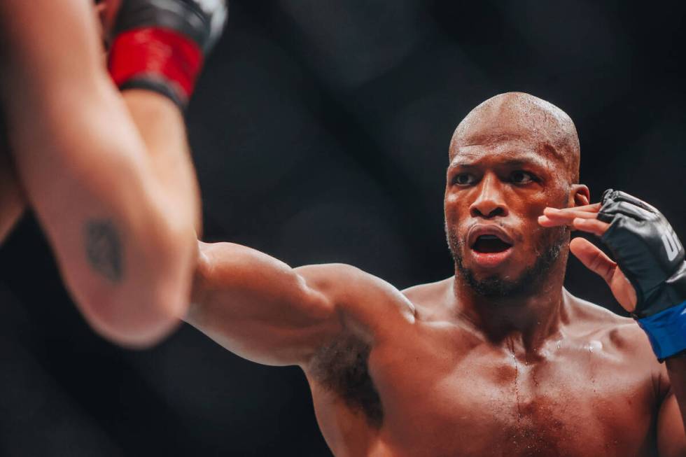 Michael Page punches Ian Machado Garry during their welterweight bout at UFC 303 at T-Mobile Ar ...