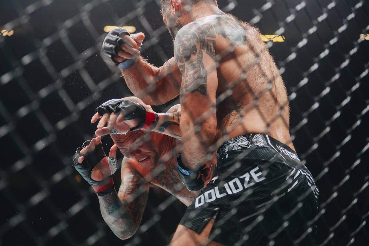 Anthony Smith, facing, fights Roman Dolidze during the light heavyweight bout at UFC 303 at T-M ...