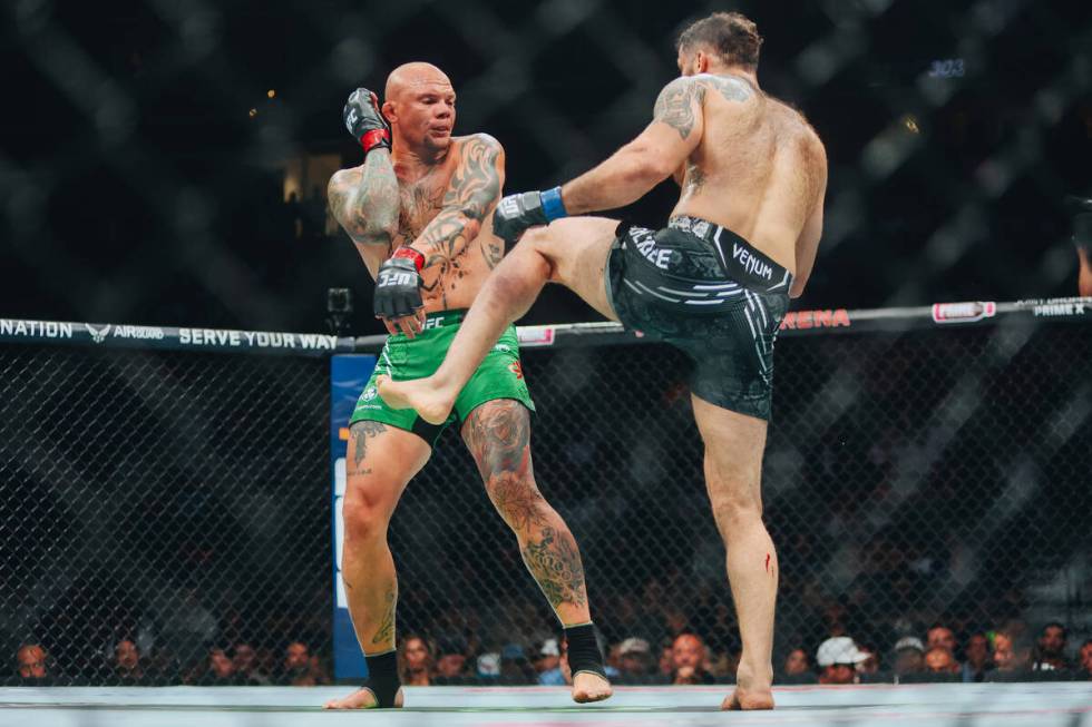 Anthony Smith, facing, fights Roman Dolidze during the light heavyweight bout at UFC 303 at T-M ...
