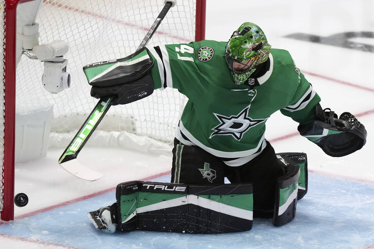 Dallas Stars goaltender Scott Wedgewood turns the puck away during the second period of Game 3 ...