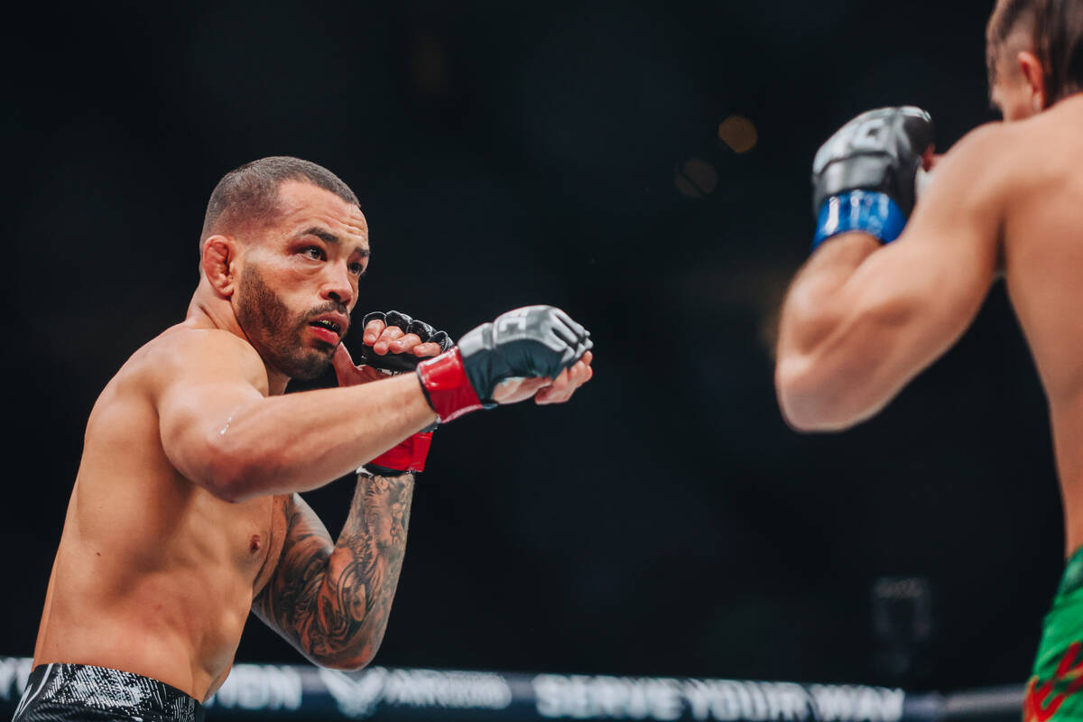 Dan Ige throws a punch at Diego Lopes during their catchweight bout at UFC 303 at T-Mobile Aren ...