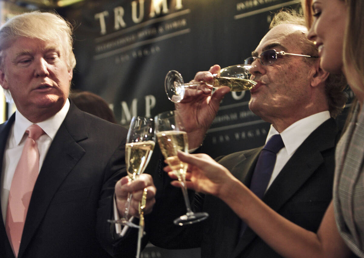 Donald Trump toasts Phil Ruffin and Ruffin's wife, Oleksandra, during the ribbon-cutting for Tr ...