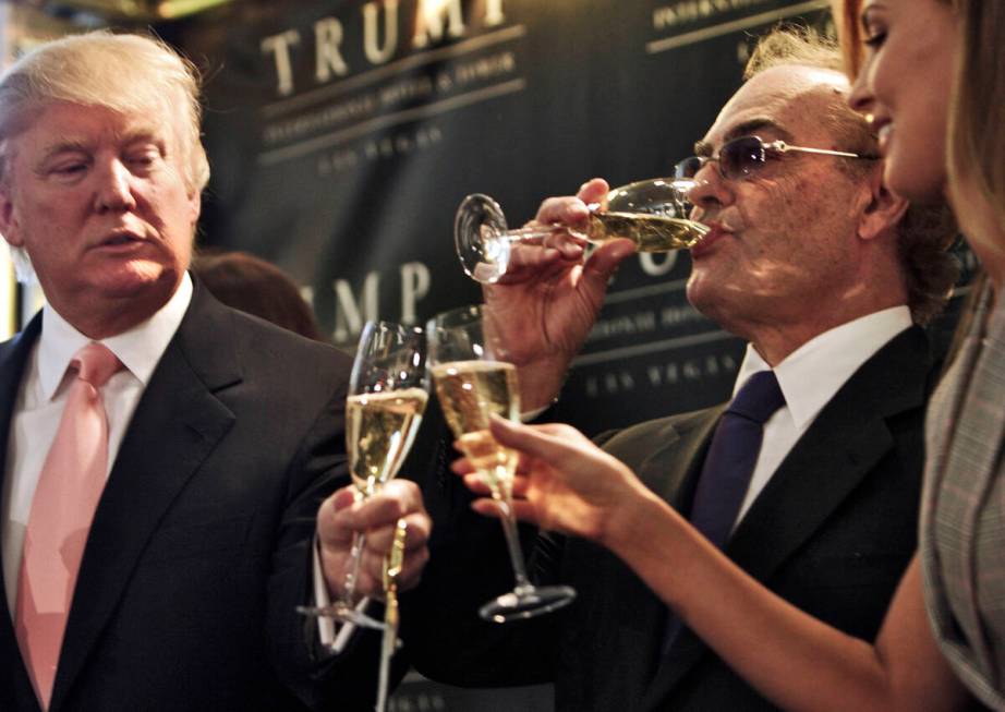 Donald Trump toasts Phil Ruffin and Ruffin's wife, Oleksandra, during the ribbon-cutting for Tr ...