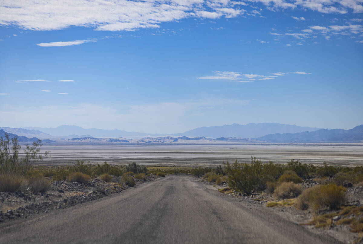 A dry lake bed is seen in the distance along Zzyzx Road, off of Interstate 15, on Tuesday, June ...