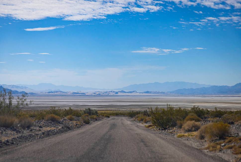 A dry lake bed is seen in the distance along Zzyzx Road, off of Interstate 15, on Tuesday, June ...