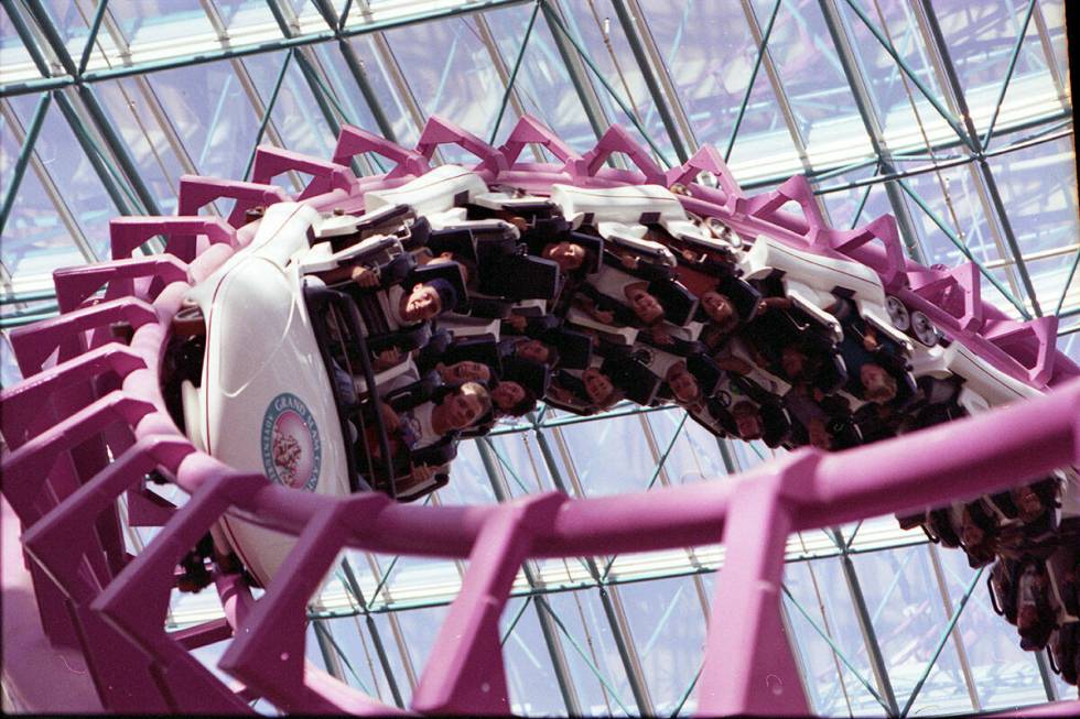Guests ride the Canyon Blaster roller coaster inside the Adventuredome at Circus Circus on Aug. ...