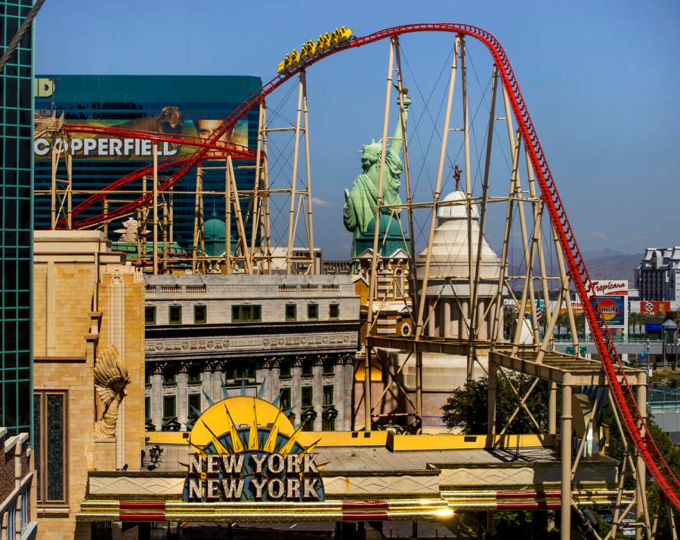 Guests take a ride on the Big Apple Coaster at New York-New York on Thursday, June 4, 2020 in L ...