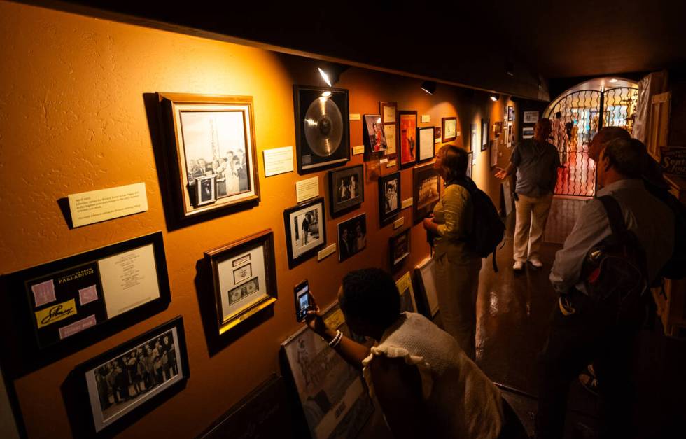 People take pictures during a tour of the Liberace Museum Collection at Thriller Villa, a forme ...