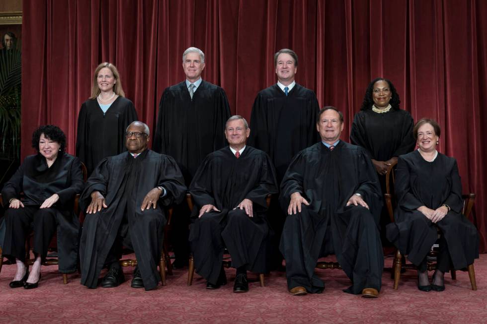 FILE - Members of the Supreme Court sit for a group portrait in Washington, Oct. 7, 2022. Botto ...