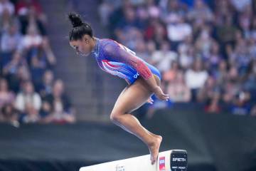 Simone Biles bobbles and falls off the balance beam at the United States Gymnastics Olympic Tri ...