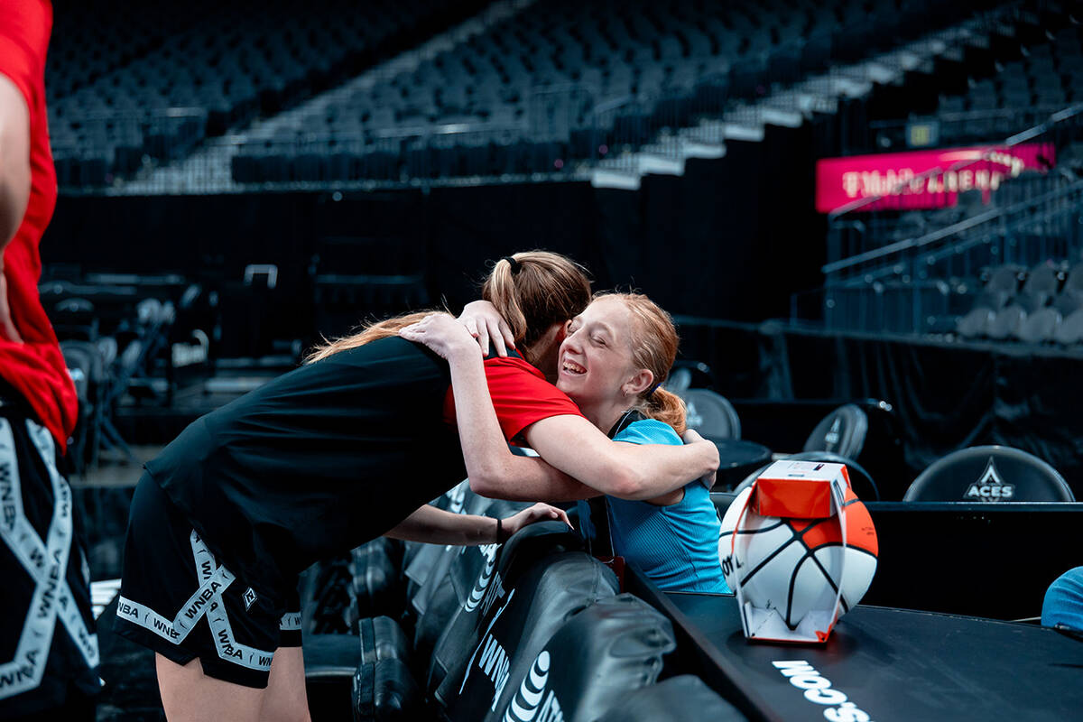 Las Vegas Aces rookie guard Kate Martin hugs Bailey Lux during practice Monday, July 1, 2024, i ...