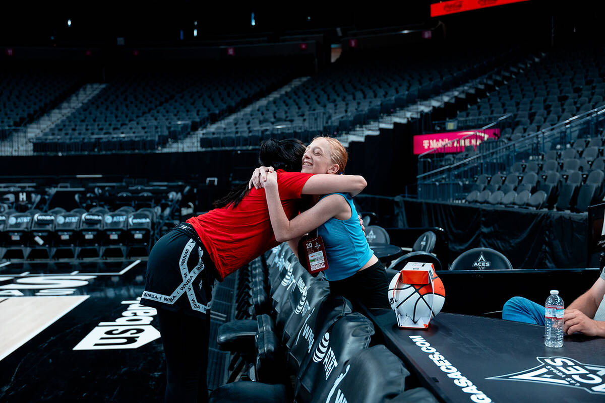 Las Vegas Aces veteran Alysha Clark hugs Bailey Lux during practice Monday, July 1, 2024, in La ...