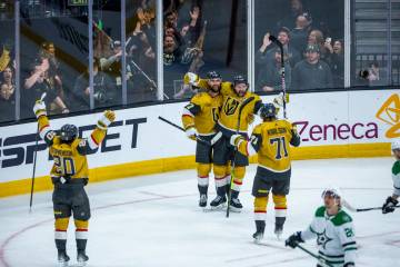 Golden Knights right wing Mark Stone (61) is celebrated with teammates for an empty net goal ag ...