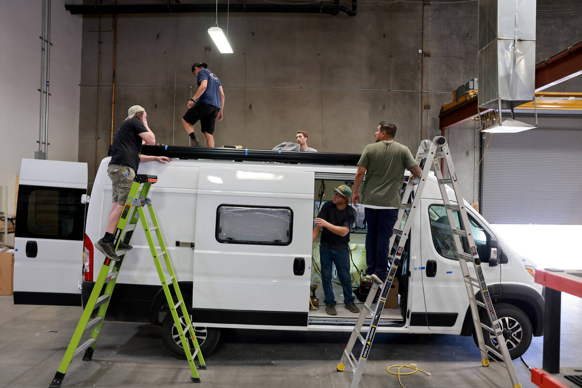 Workers convert a van into a mobile home at Noovo manufacturing facility in Las Vegas Thursday, ...