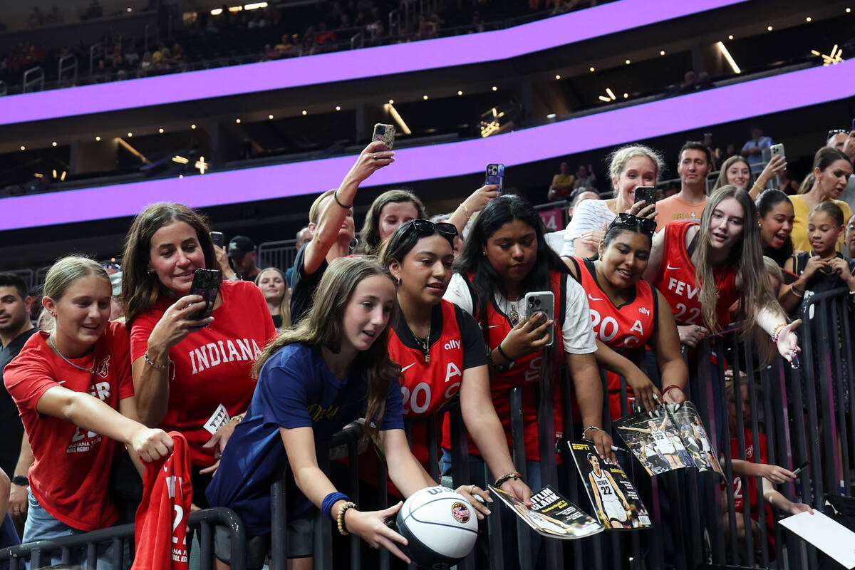 Fans ask for autographs before a WNBA basketball game between the Las Vegas Aces and the Indian ...