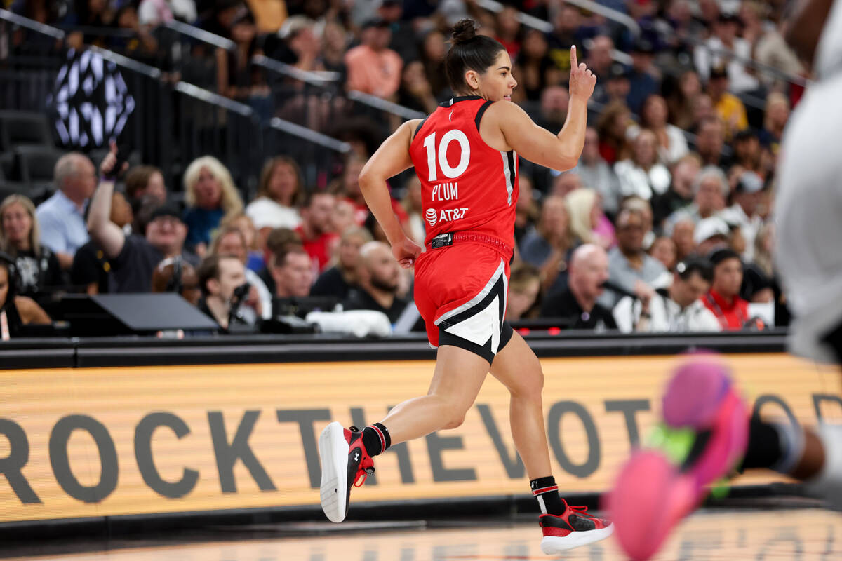 Las Vegas Aces guard Kelsey Plum (10) celebrates after scoring during the first half of a WNBA ...