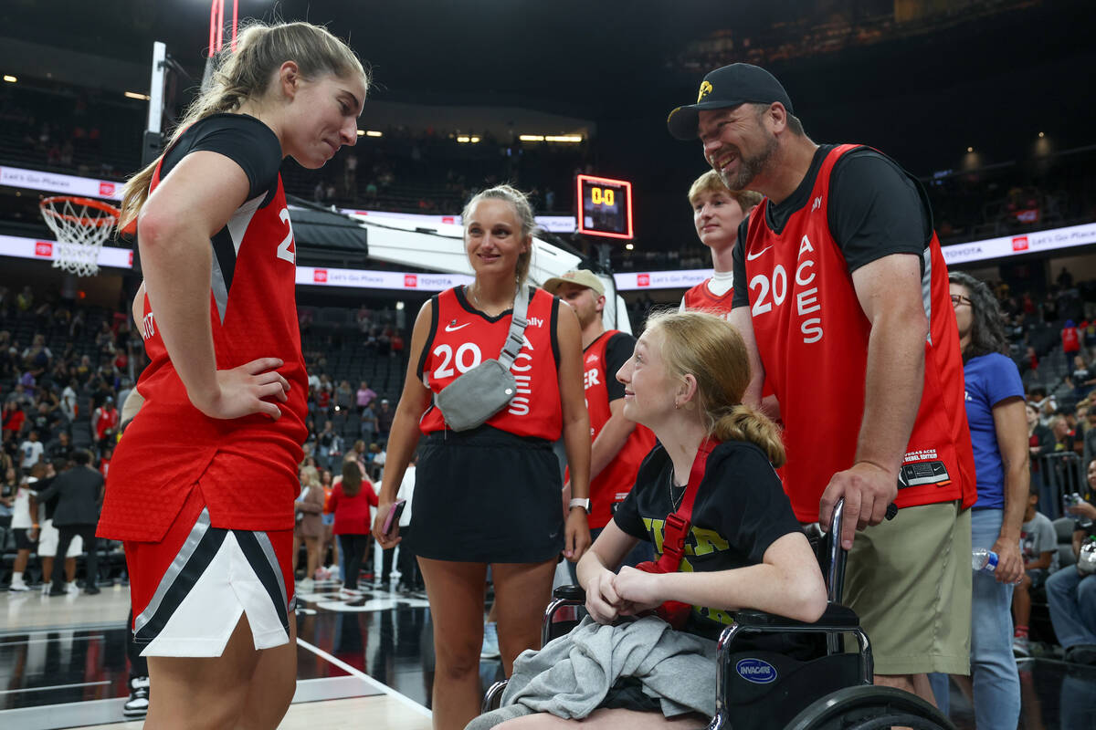 Las Vegas Aces guard Kate Martin, left, chats with Bailey Lux, 14, after a WNBA basketball game ...