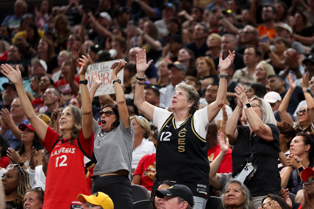 Las Vegas Aces fans cheer for their team during the second half of a WNBA basketball game again ...
