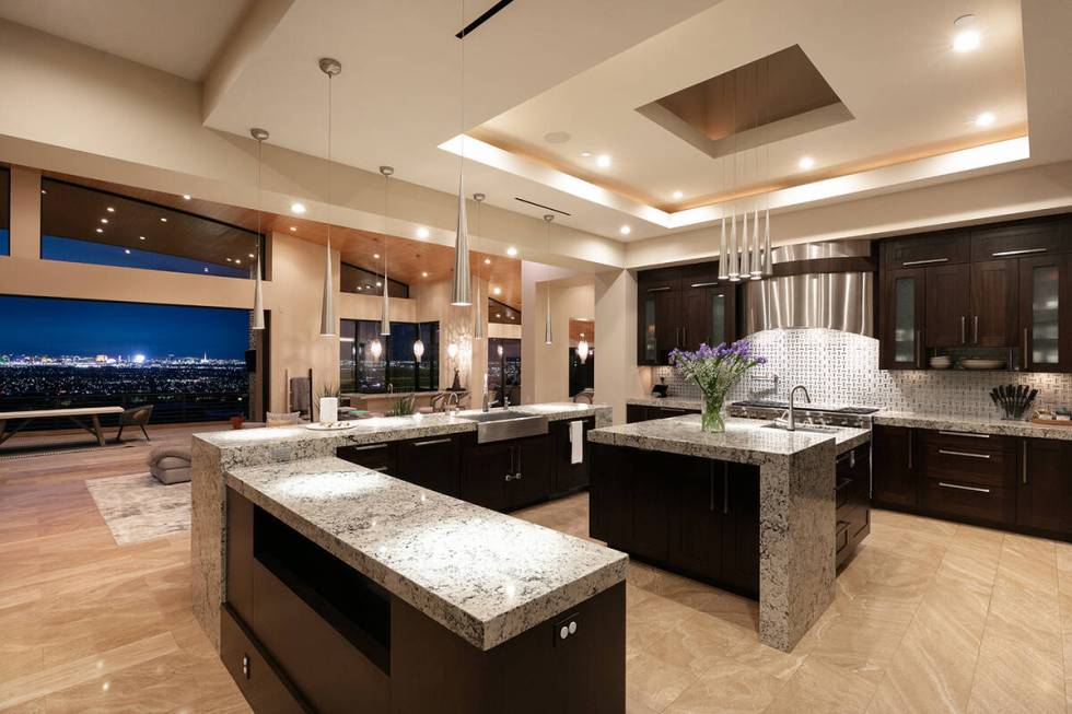 Adjoining the great room is a grand chef-style kitchen that includes top-line appliances, an is ...