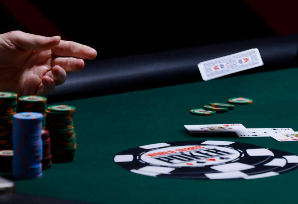 A poker player surrenders during the first day of the World Series of Poker Main Event at Horse ...